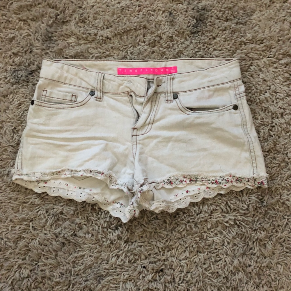 cute light wash shorts with flower detail trim